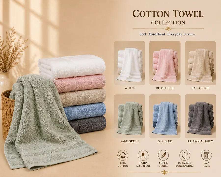 Rolled white and maroon cotton bath towels styled on a shelf